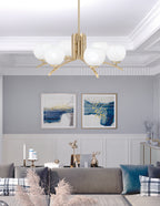 Kurve Six Light Chandelier in New Age Brass with White Marble Shade