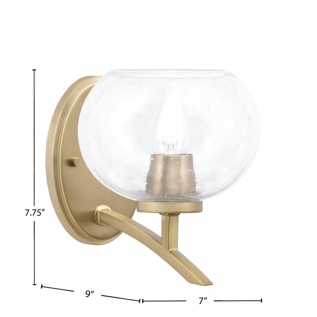 Kurve One Light Wall Sconce in New Age Brass with 7" Clear Bubble Shade