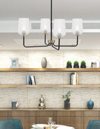 Sandia Four Light Chandelier in Matte Black & New Age Brass with Clear Textured Shade
