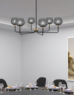 Sandia Six Light Chandelier in Matte Black & New Age Brass with Smoke Textured Shade