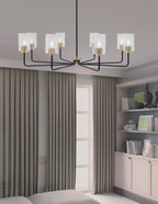 Sandia Eight Light Chandelier in Matte Black & New Age Brass with Clear Bubble Shade