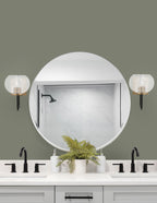 Sandia One Light Wall Sconce in Matte Black & New Age Brass with Clear Bubble Shade